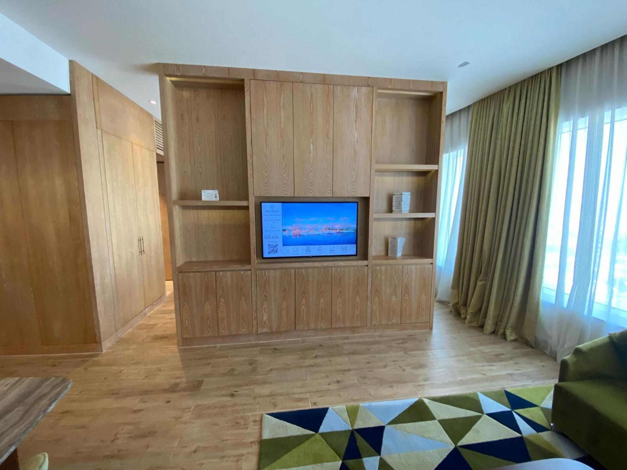 The Bentley Luxury Hotel & Suites Doha Ngoại thất bức ảnh A television in a hotel room